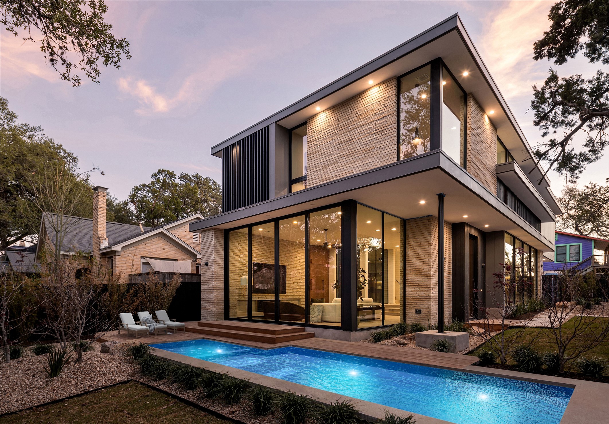 915 Columbus Street Austin, TX 78704 - Photo 32 of 34 Rear view of house with a patio and an outdoor pool