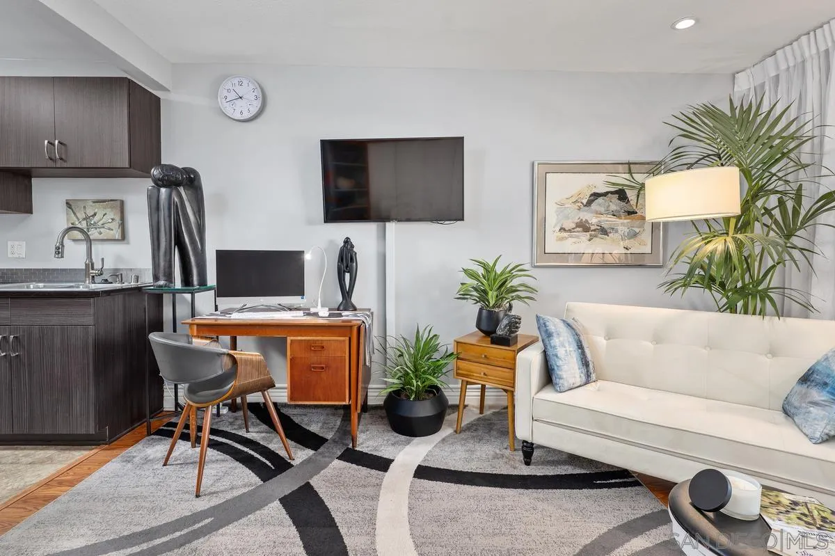 3980 8th Avenue, Unit 308 San Diego, CA 92103 - Photo 12 of 33 a living room with furniture and a flat screen tv