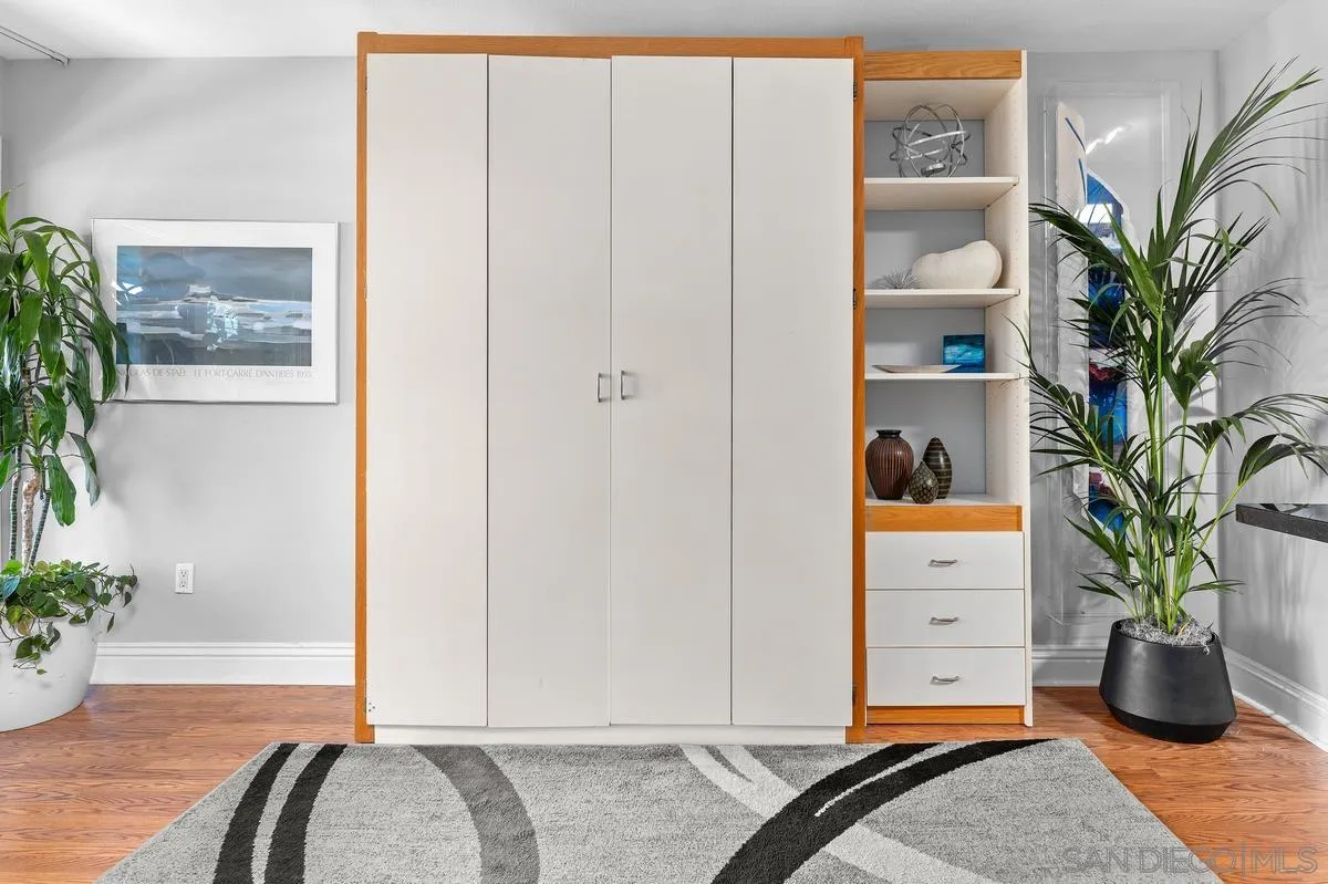 3980 8th Avenue, Unit 308 San Diego, CA 92103 - Photo 13 of 33 a living room with furniture and potted plant