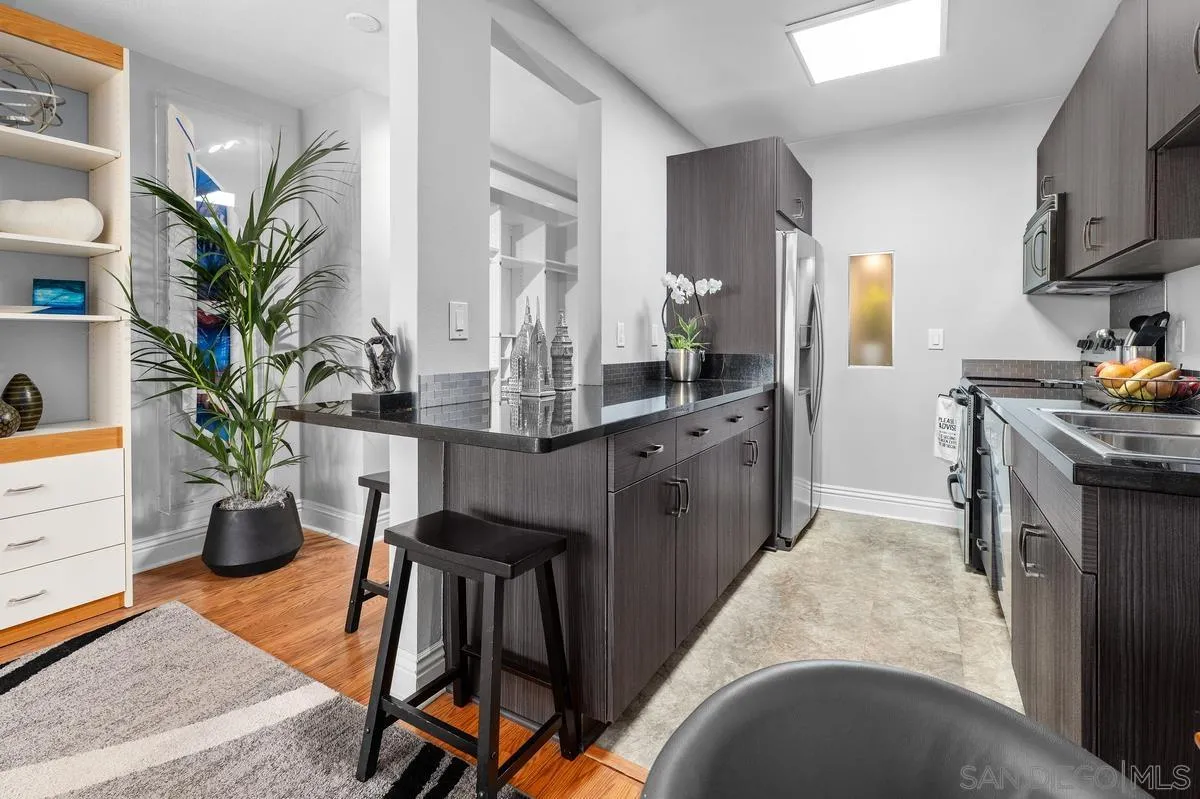 3980 8th Avenue, Unit 308 San Diego, CA 92103 - Photo 17 of 33 a kitchen with sink and outdoor seating