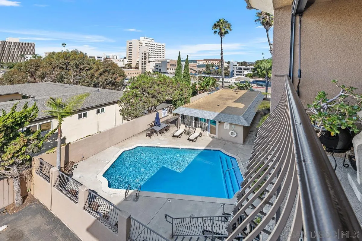 3980 8th Avenue, Unit 308 San Diego, CA 92103 - Photo 22 of 33 a view of a balcony with table and chairs and potted plants