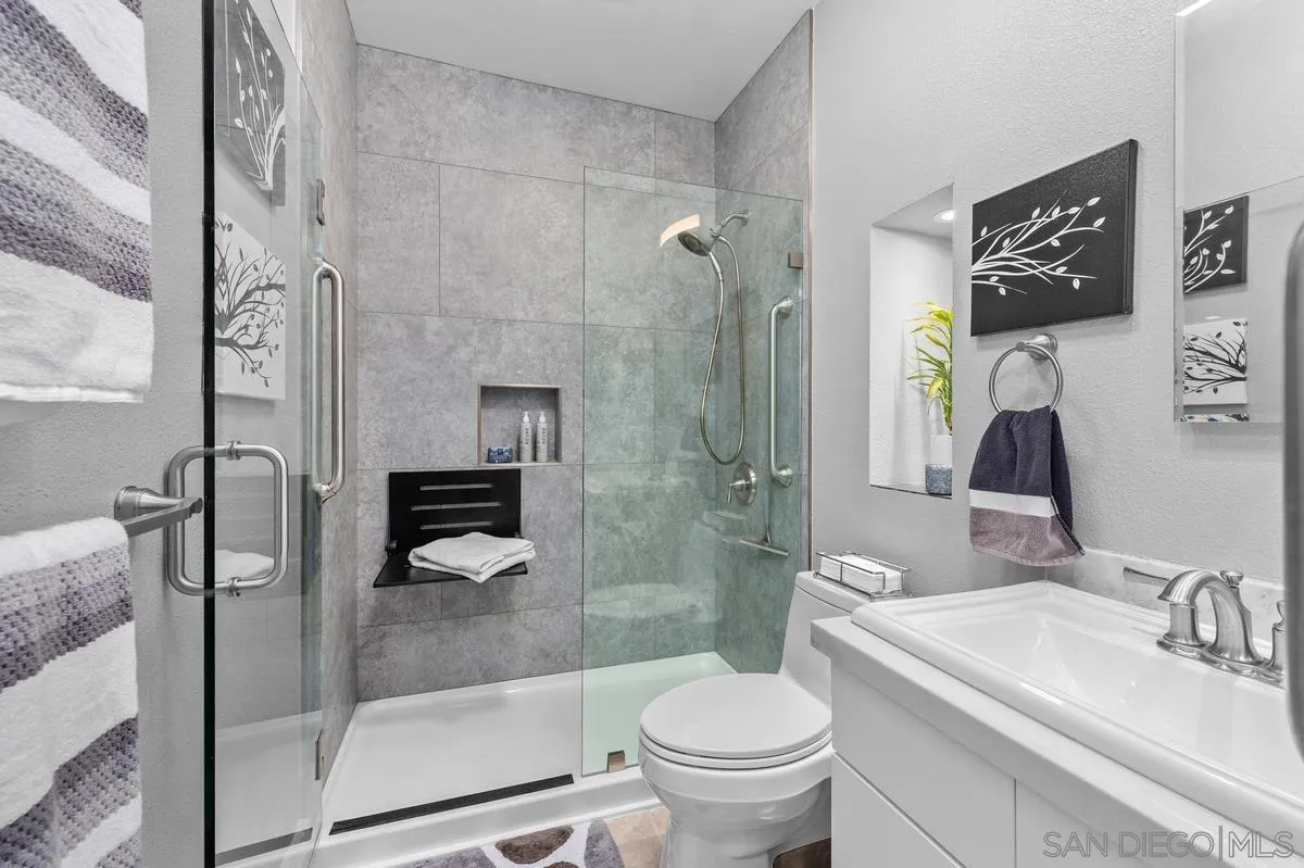 3980 8th Avenue, Unit 308 San Diego, CA 92103 - Photo 24 of 33 a bathroom with a sink toilet and shower