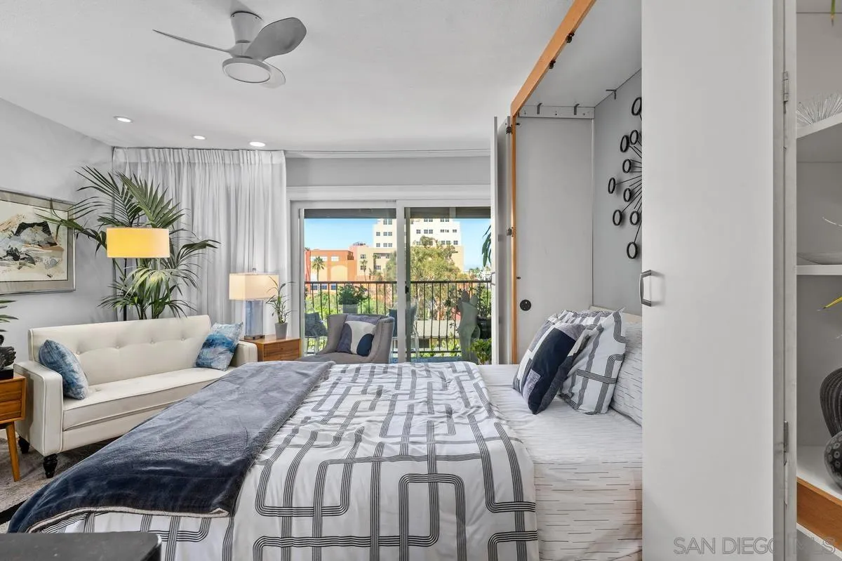 3980 8th Avenue, Unit 308 San Diego, CA 92103 - Photo 6 of 33 a bedroom with a large bed and a large window