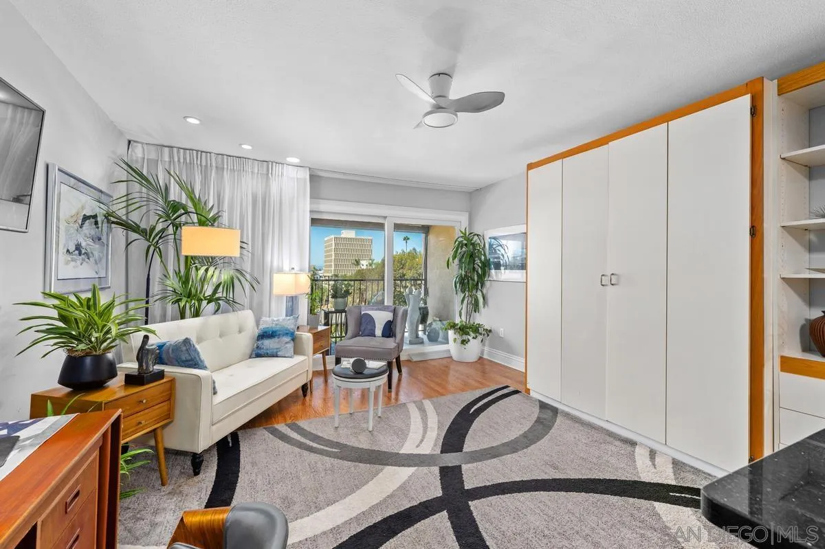 3980 8th Avenue, Unit 308 San Diego, CA 92103 - Photo 10 of 33 a living room with furniture and a potted plant
