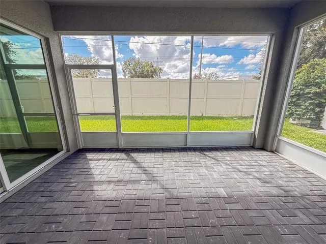 a view of an empty room with a window