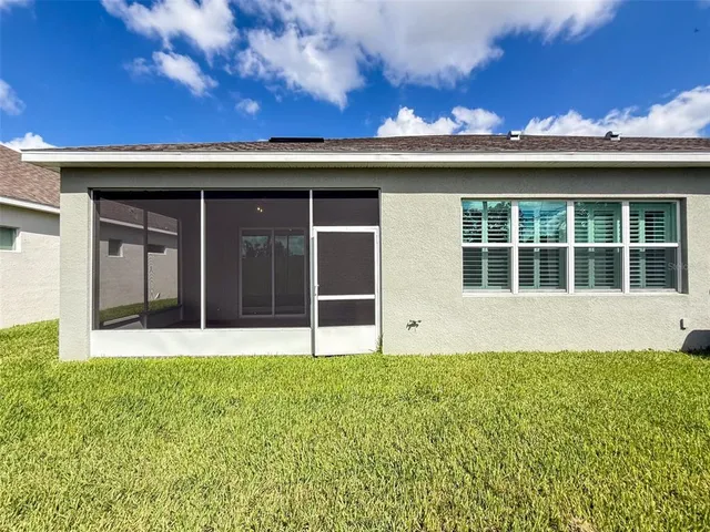 a view of front door of house with yard