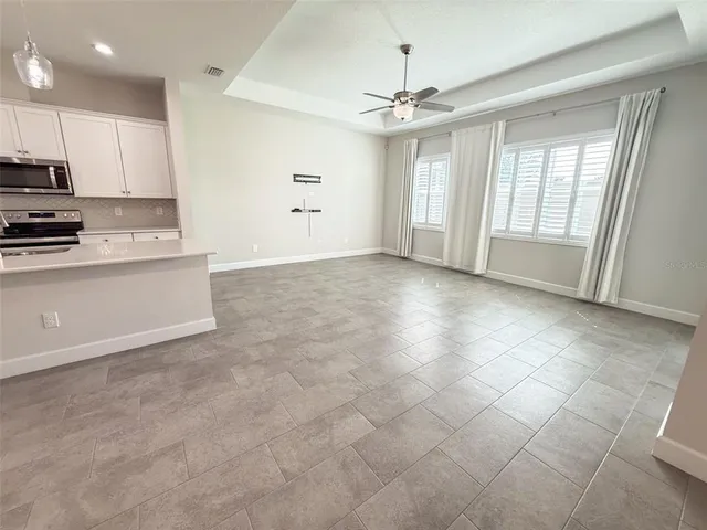 a view of a kitchen with a sink and a stove top oven