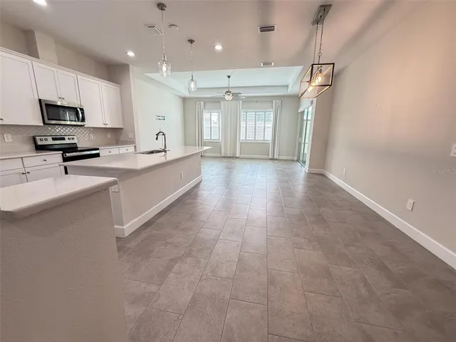 a large kitchen with cabinets