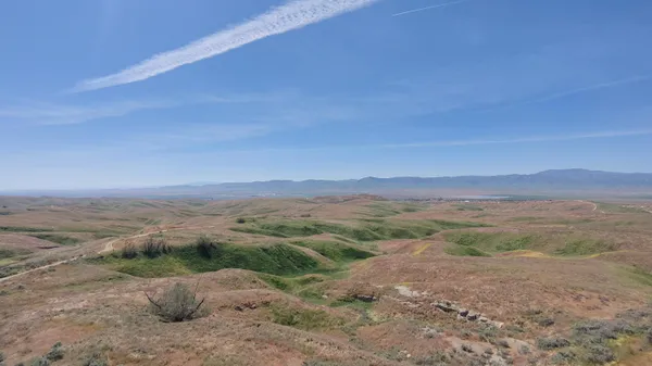 a view of a road with an ocean