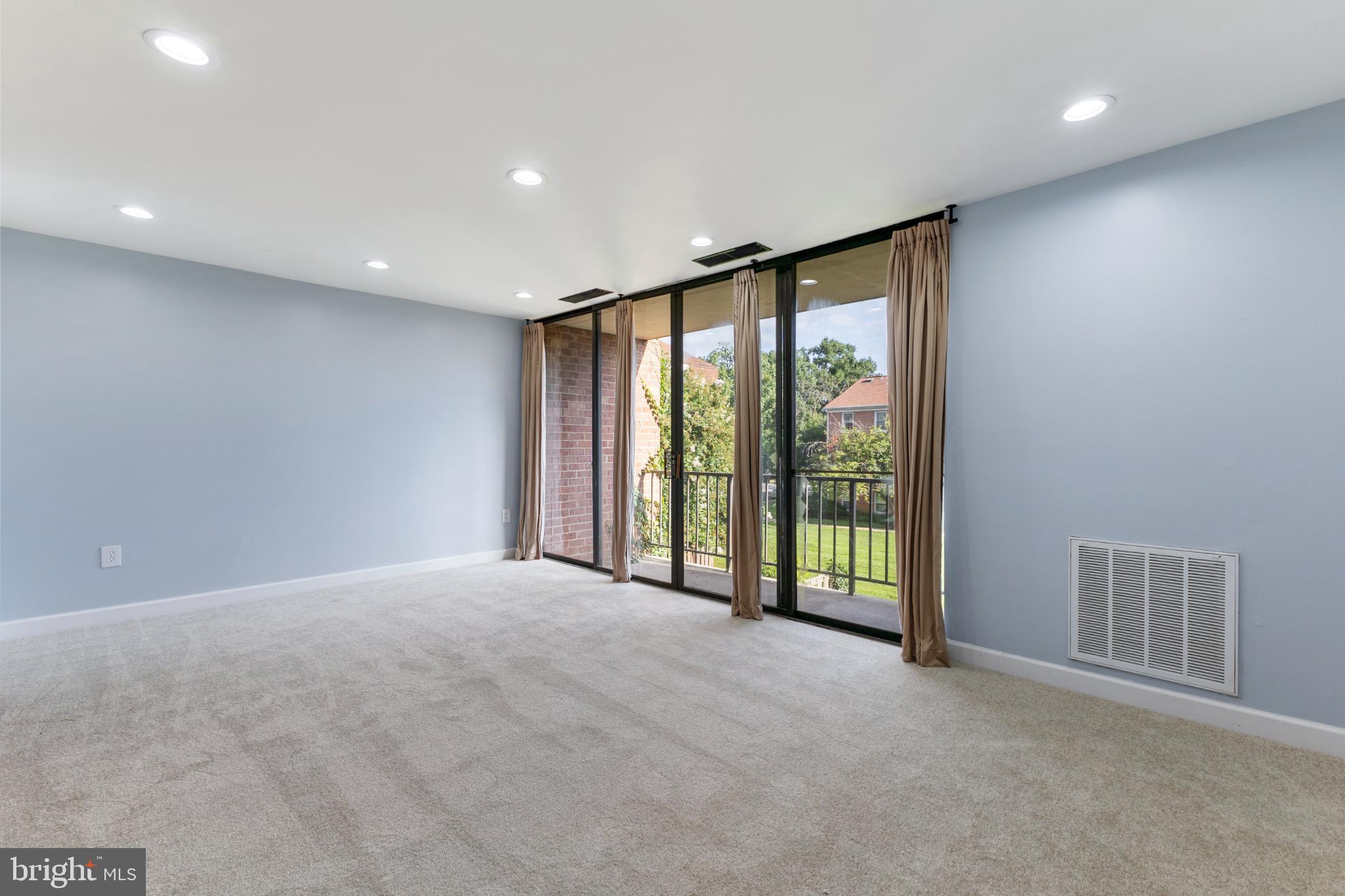 776 Quince Orchard Boulevard, Unit 102 Gaithersburg, MD 20878 - Photo 7 of 14 a view of an empty room with glass door