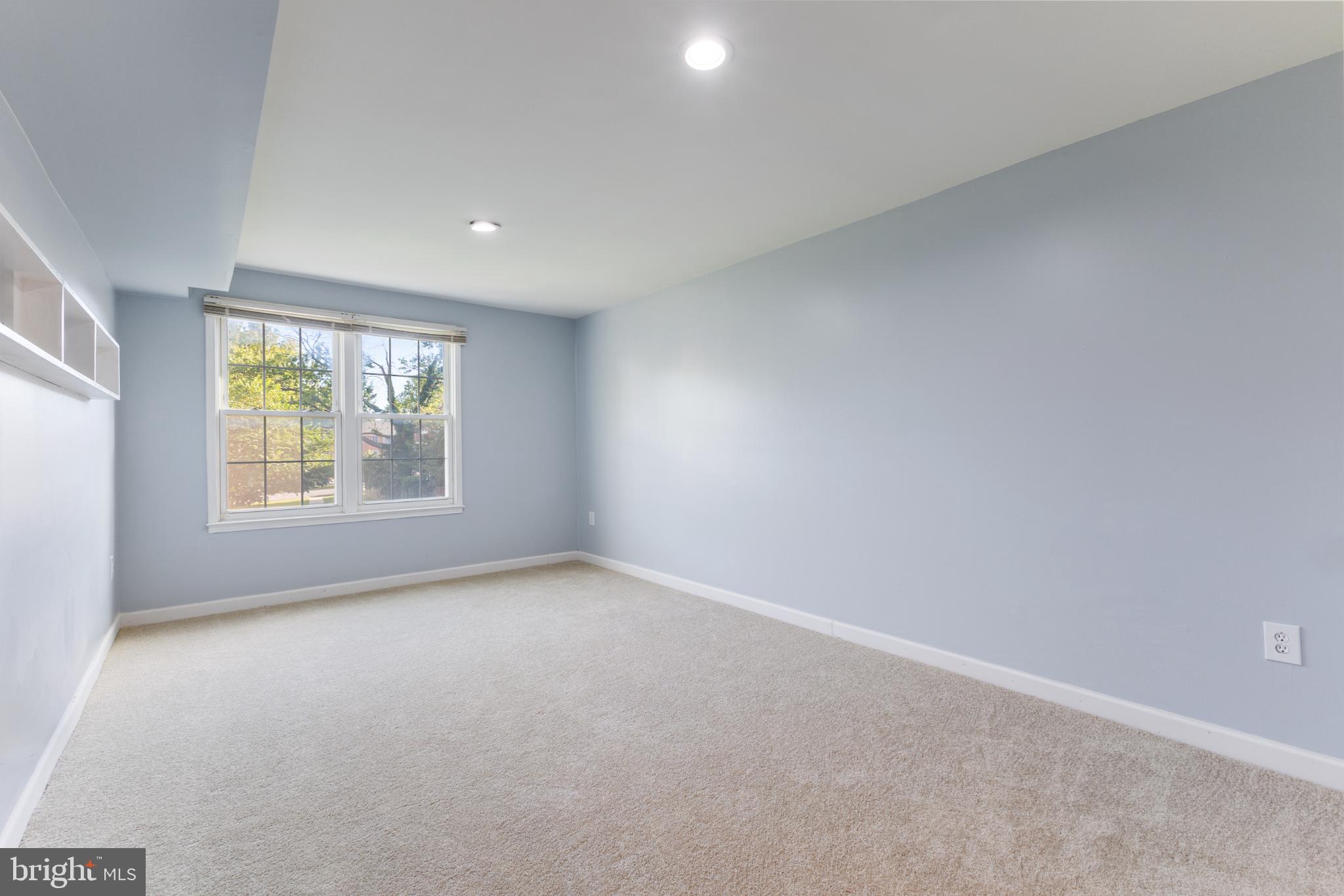 776 Quince Orchard Boulevard, Unit 102 Gaithersburg, MD 20878 - Photo 10 of 14 an empty room with windows