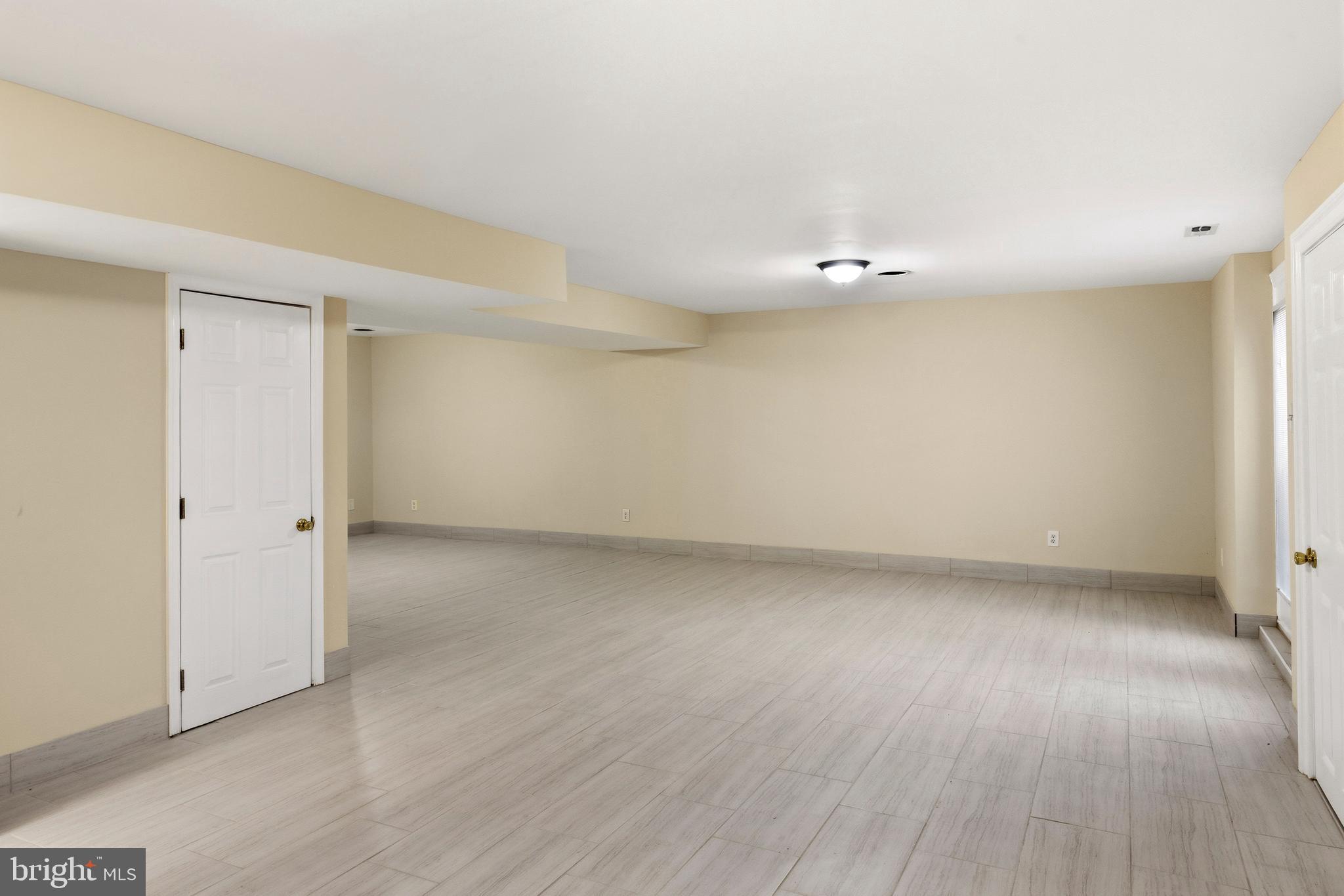 4704 Denview Way Baltimore, MD 21206 - Photo 32 of 42 wooden floor in an empty room with a window