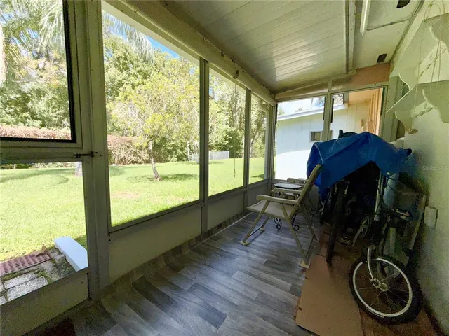 a room with wooden floor and furniture