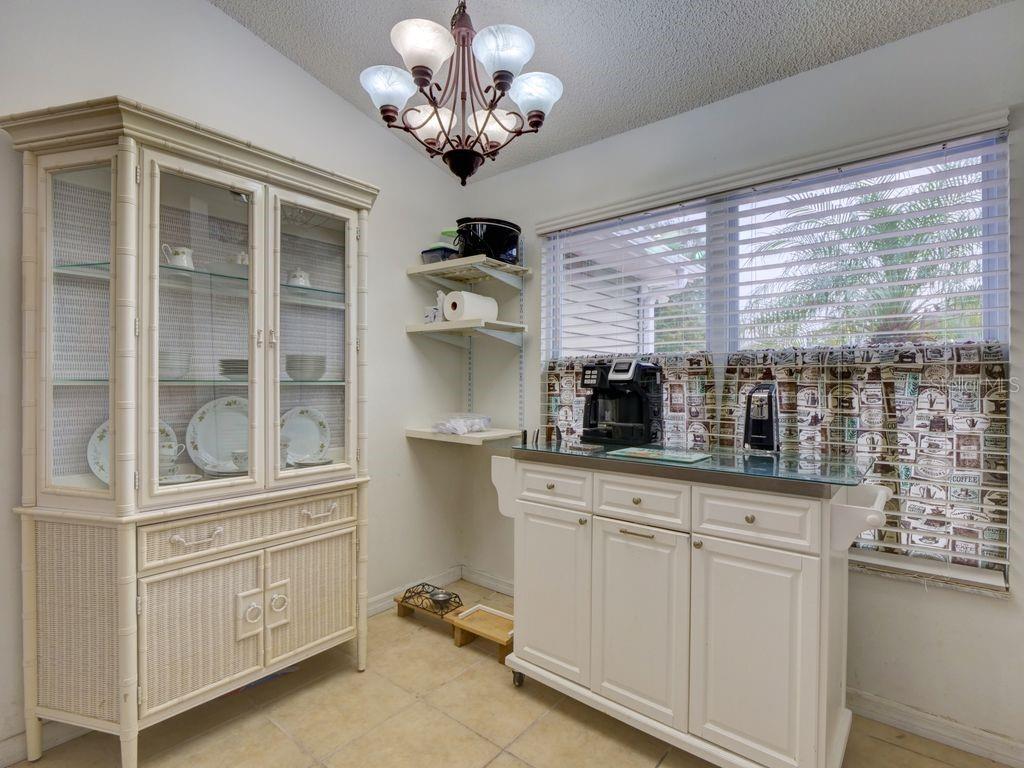698 Colchester Avenue Deltona, FL 32738 - Photo 11 of 30 a kitchen with stainless steel appliances granite countertop a stove a sink and a cabinets