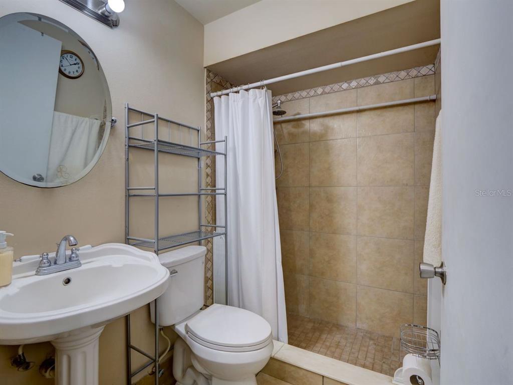 698 Colchester Avenue Deltona, FL 32738 - Photo 16 of 30 a bathroom with a sink toilet and shower