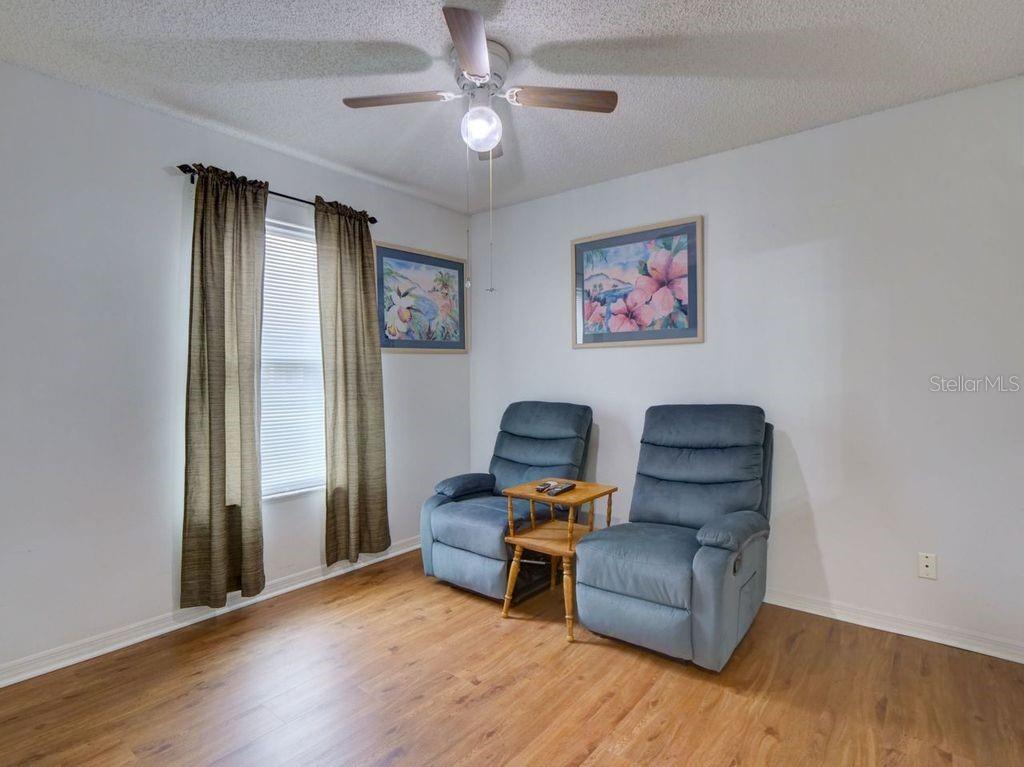 698 Colchester Avenue Deltona, FL 32738 - Photo 17 of 30 a living room with furniture and a window