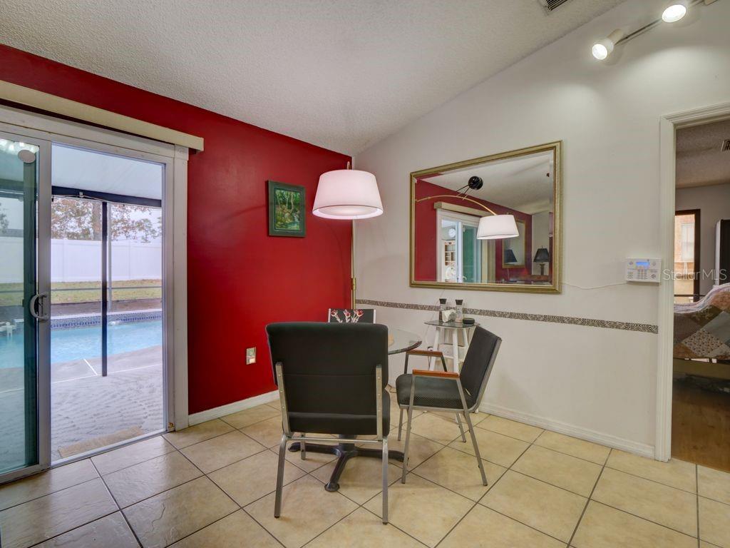 698 Colchester Avenue Deltona, FL 32738 - Photo 8 of 30 a view of a livingroom with furniture and windows