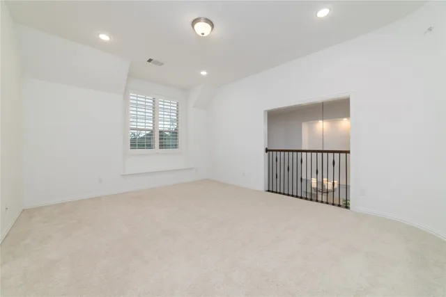 en empty room with windows and stairs