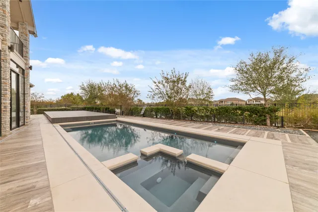a view of swimming pool with a lounge chair