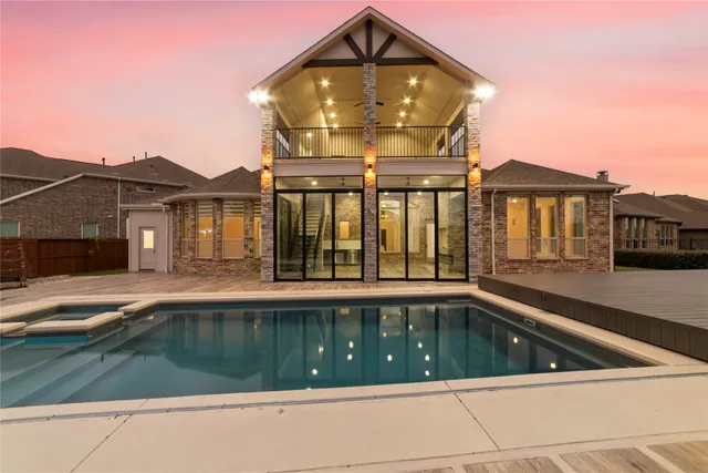 a view of swimming pool with a balcony