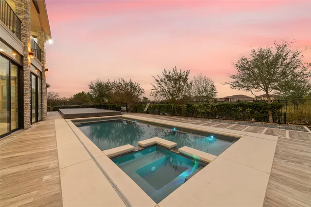 a view of swimming pool from a balcony