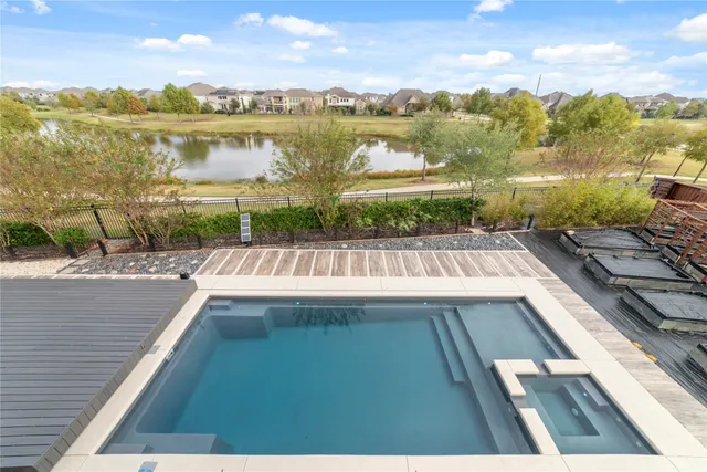 a view of swimming pool from a balcony