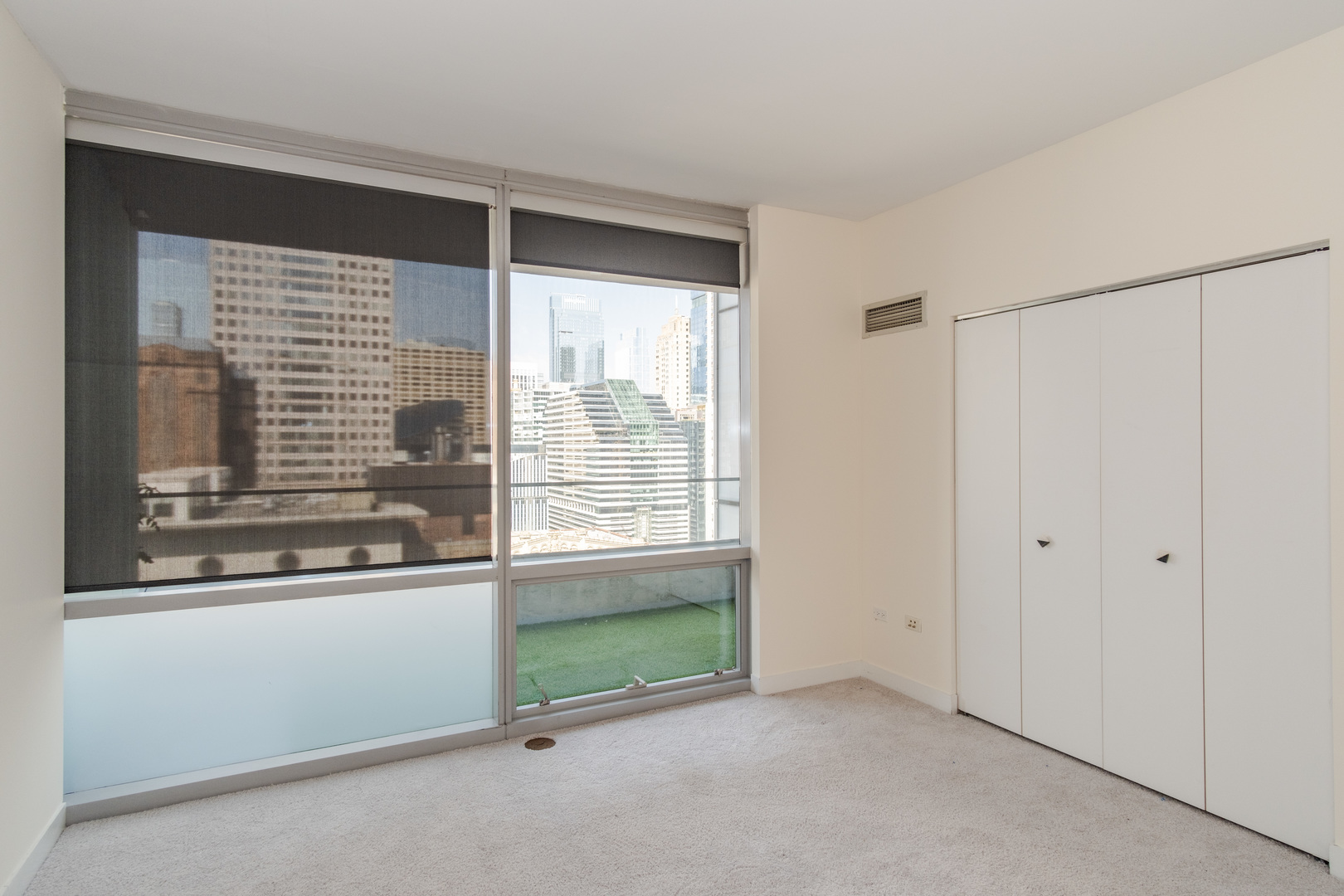 8 East Randolph Street, Unit 1806 Chicago, IL 60601 - Photo 15 of 23 a view of an empty room with a window