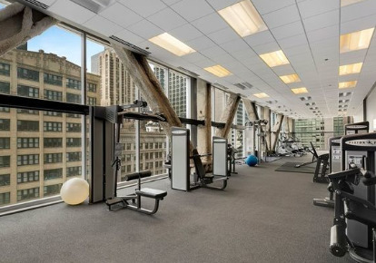 8 East Randolph Street, Unit 1806 Chicago, IL 60601 - Photo 22 of 23 a view of a room with gym equipment