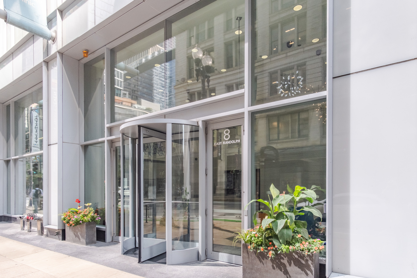 8 East Randolph Street, Unit 1806 Chicago, IL 60601 - Photo 3 of 23 a view of a potted plant in front of a glass door