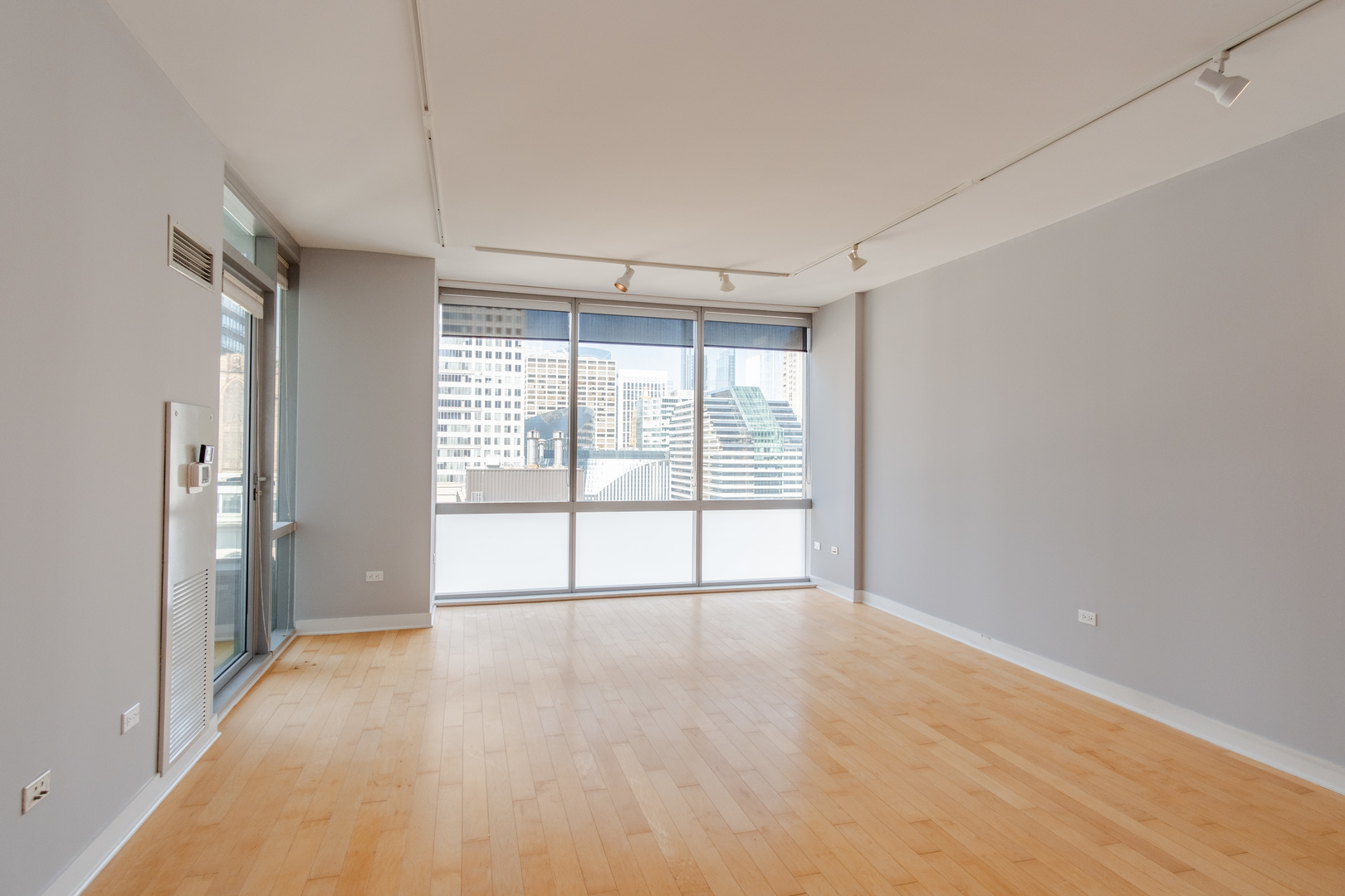 8 East Randolph Street, Unit 1806 Chicago, IL 60601 - Photo 7 of 23 a view of an empty room with a window