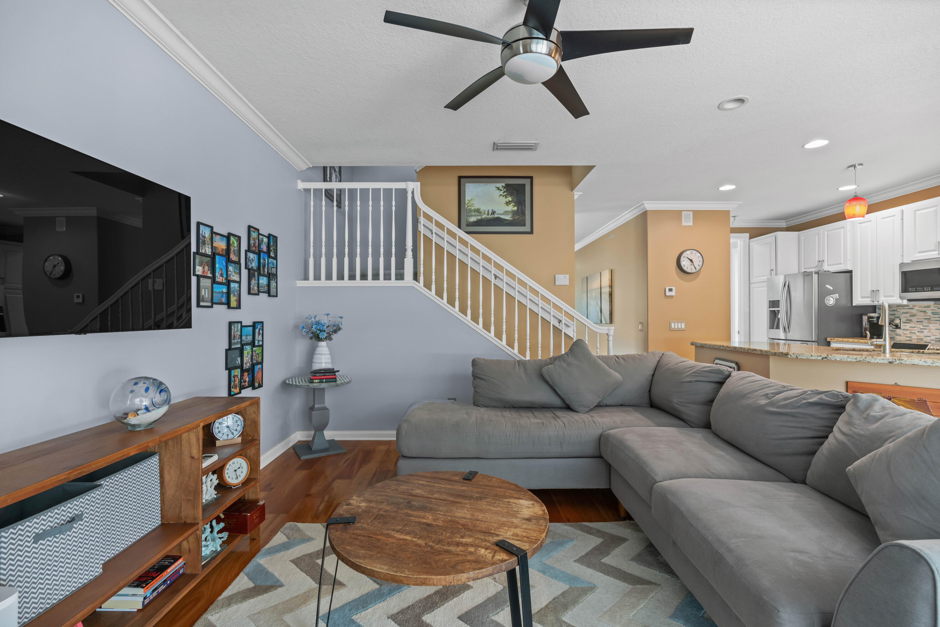 144 Sweet Bay Circle Jupiter, FL 33458 - Photo 11 of 46 a living room with furniture and a flat screen tv
