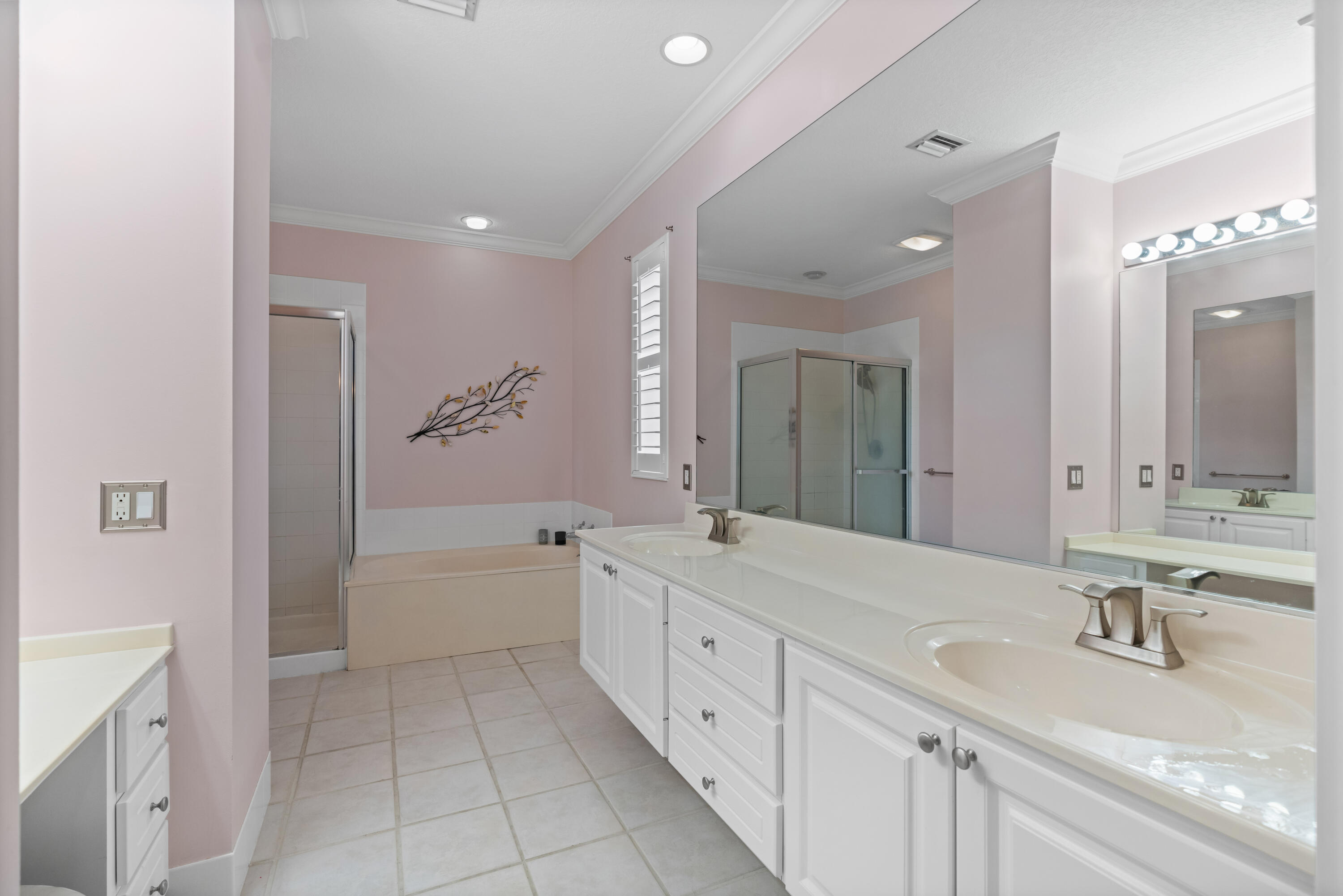 144 Sweet Bay Circle Jupiter, FL 33458 - Photo 13 of 46 a spacious bathroom with a double vanity sink mirror double and bathtub