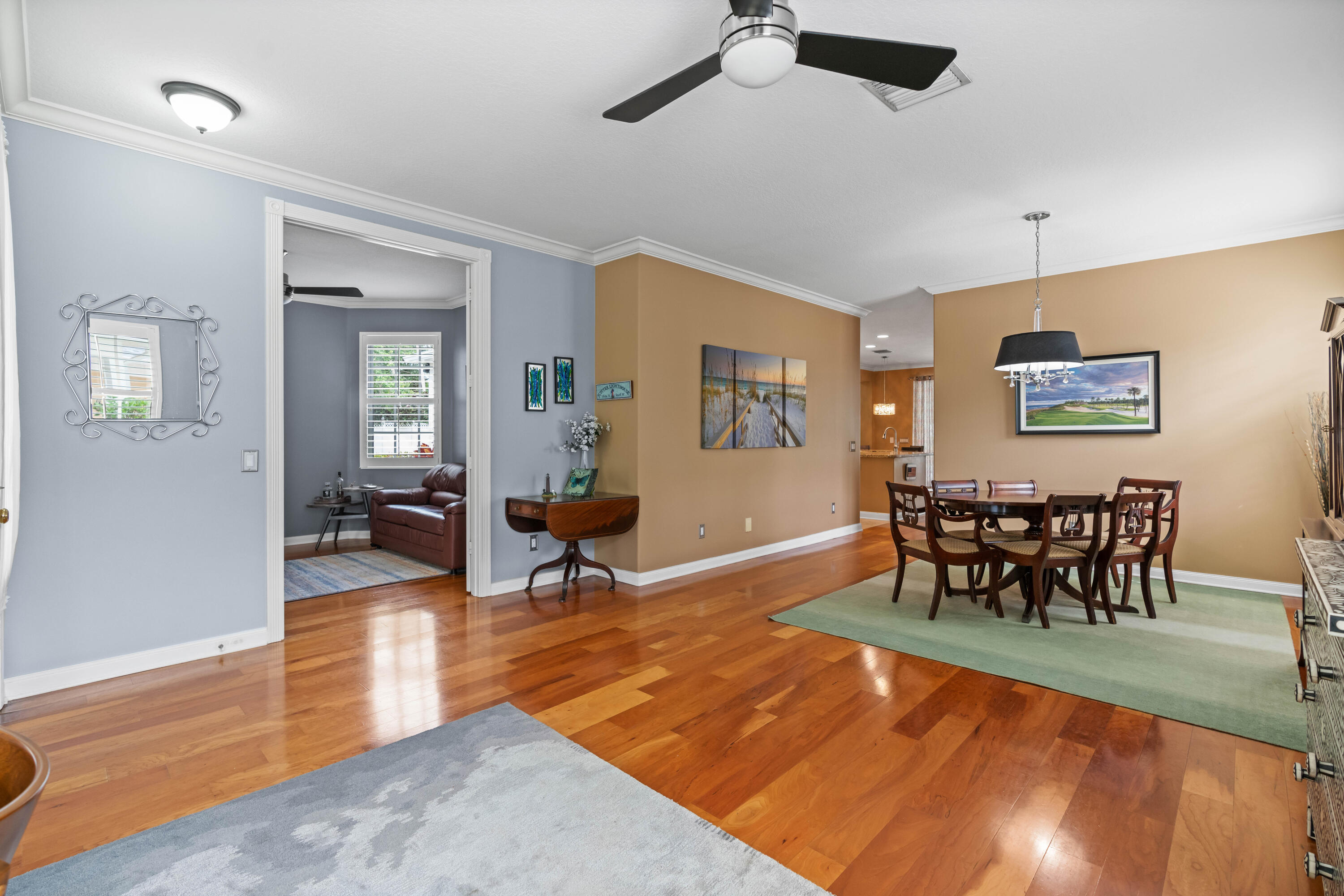 144 Sweet Bay Circle Jupiter, FL 33458 - Photo 17 of 46 a living room with furniture a dining table and chairs with wooden floor