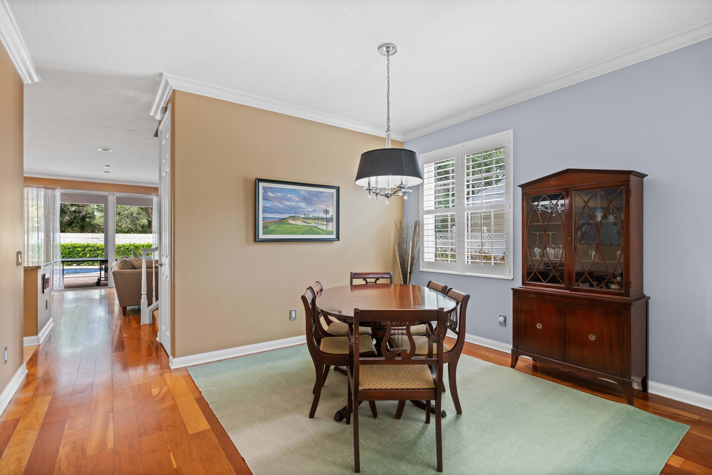 144 Sweet Bay Circle Jupiter, FL 33458 - Photo 20 of 46 a dining room with furniture window wooden floor