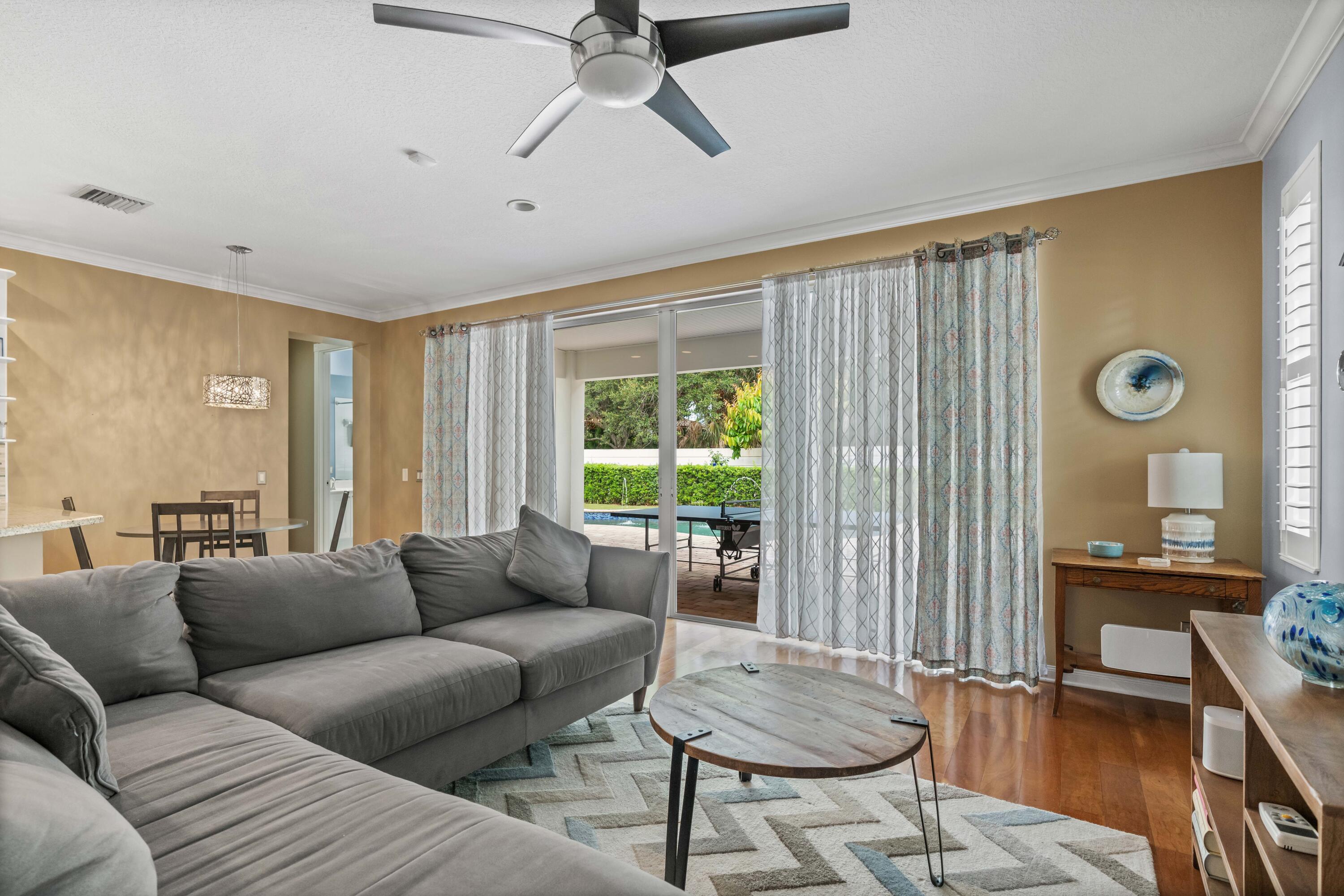 144 Sweet Bay Circle Jupiter, FL 33458 - Photo 26 of 46 a living room with furniture and a window