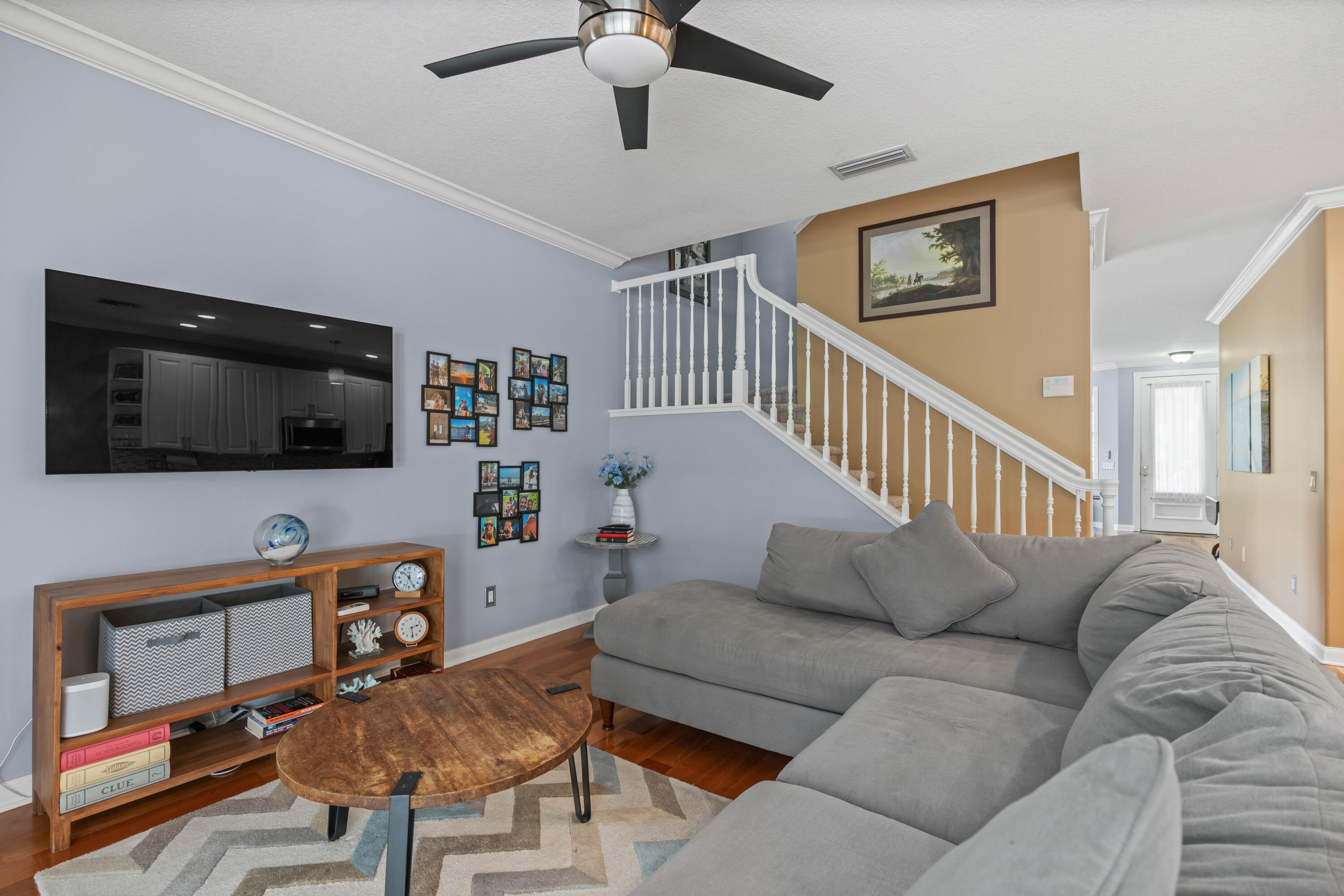 144 Sweet Bay Circle Jupiter, FL 33458 - Photo 27 of 46 a living room with furniture and a flat screen tv