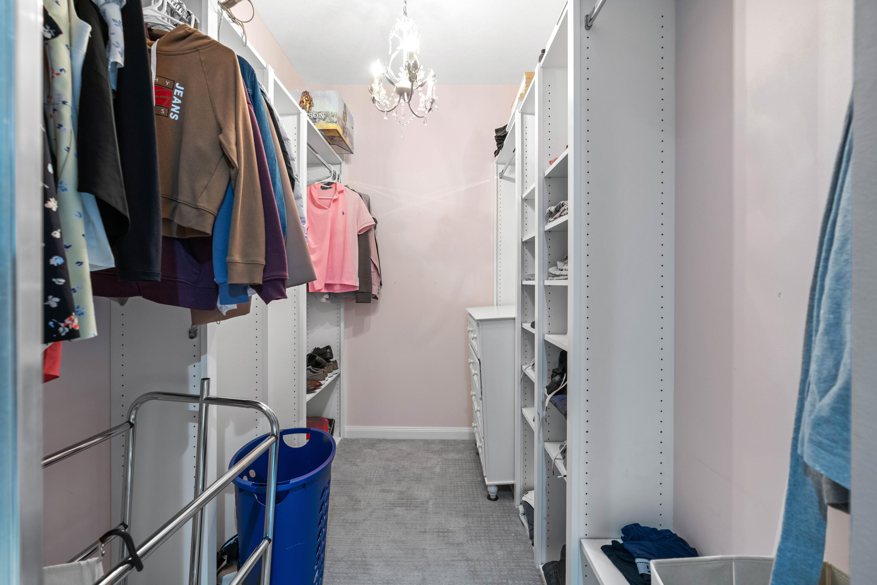144 Sweet Bay Circle Jupiter, FL 33458 - Photo 30 of 46 a view of walk in closet with clothes and shoes