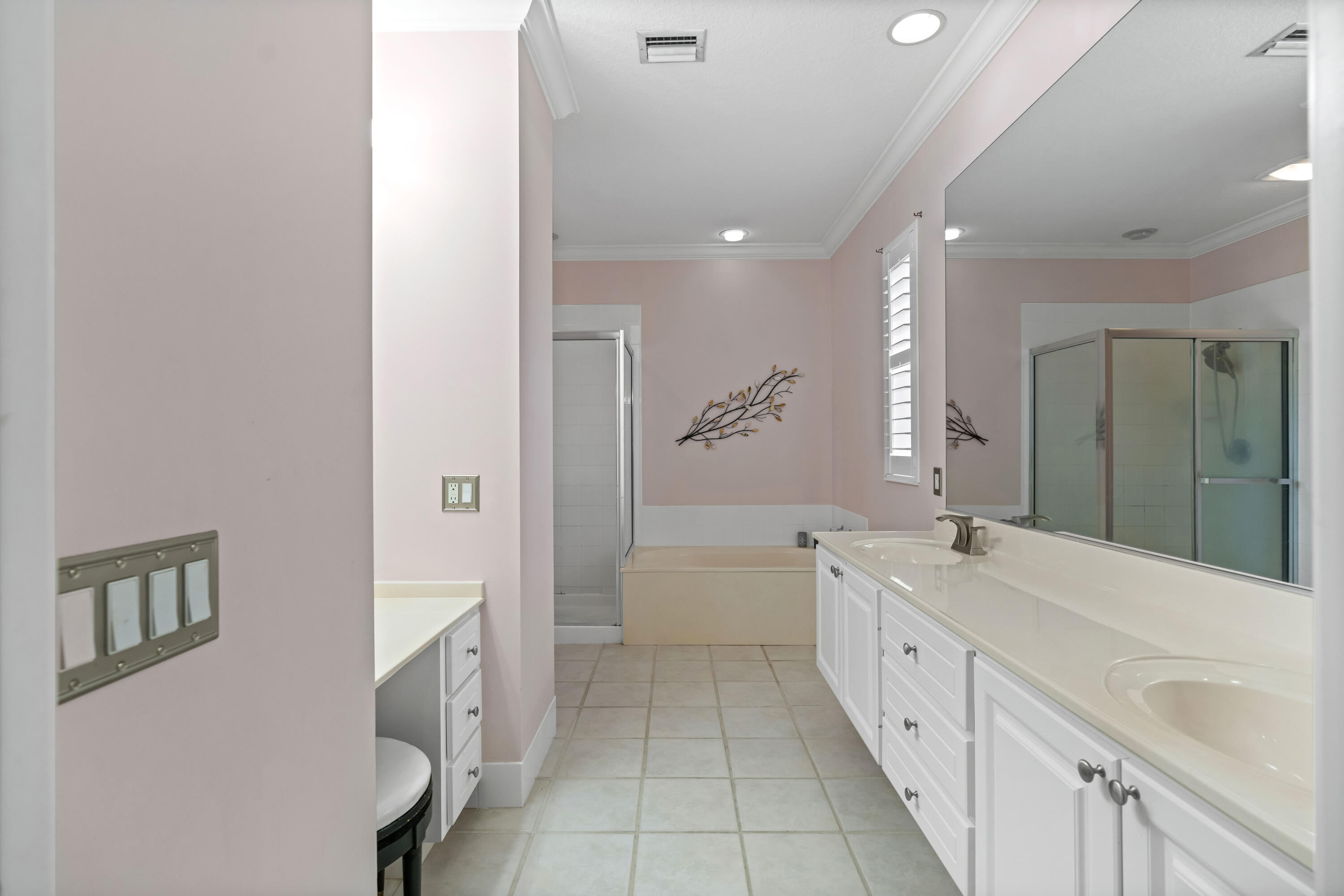 144 Sweet Bay Circle Jupiter, FL 33458 - Photo 31 of 46 a spacious bathroom with a double vanity sink a mirror and a bathtub