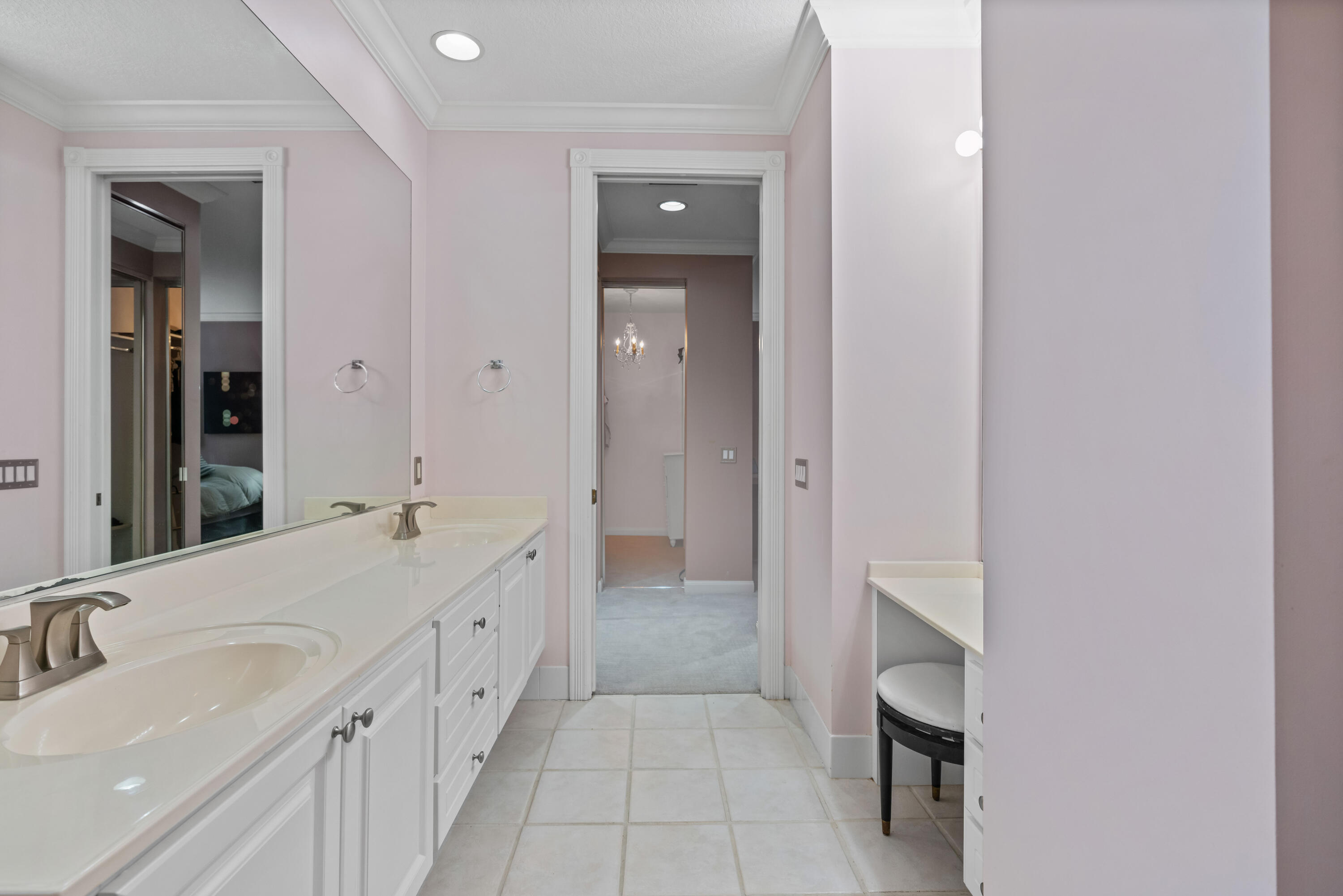 144 Sweet Bay Circle Jupiter, FL 33458 - Photo 34 of 46 a bathroom with a double vanity sink and mirror