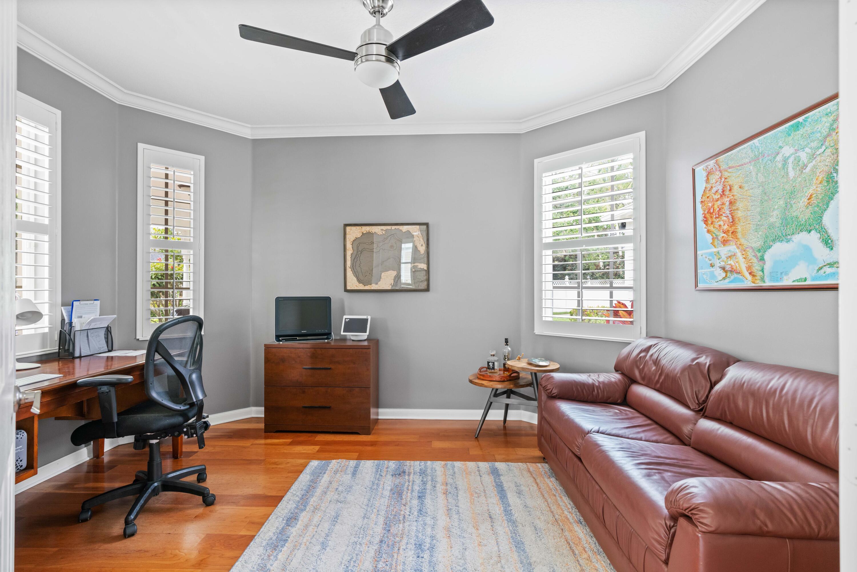 144 Sweet Bay Circle Jupiter, FL 33458 - Photo 45 of 46 a living room with furniture and a wooden floor