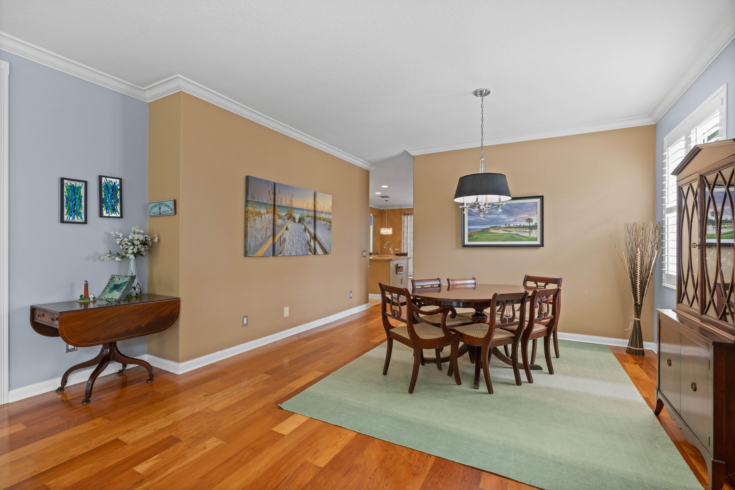 144 Sweet Bay Circle Jupiter, FL 33458 - Photo 6 of 46 a view of a dining room with furniture and wooden floor