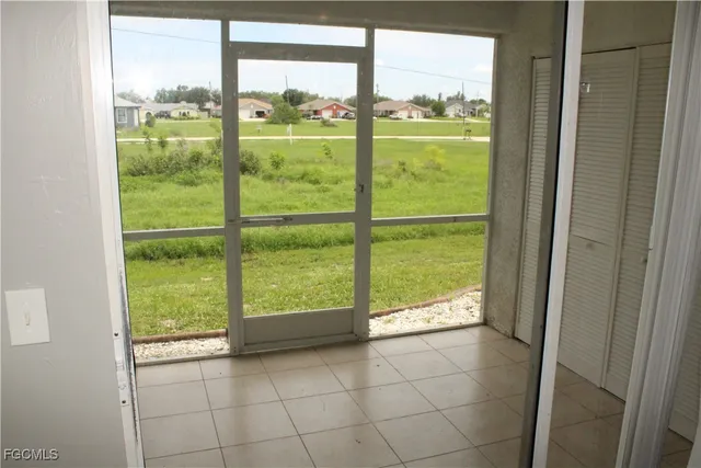 a view of a hallway with a chandelier fan