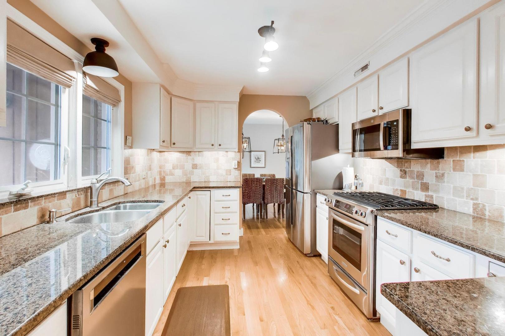 511 South Hi Lusi Avenue Mount Prospect, IL 60056 - Photo 11 of 51 a kitchen with stainless steel appliances granite countertop a stove and a sink