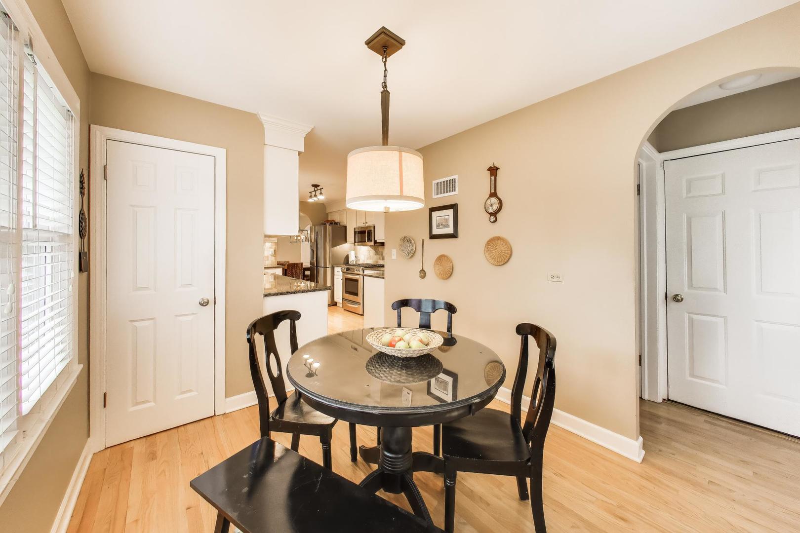 511 South Hi Lusi Avenue Mount Prospect, IL 60056 - Photo 16 of 51 a view of a dining room with furniture window and wooden floor