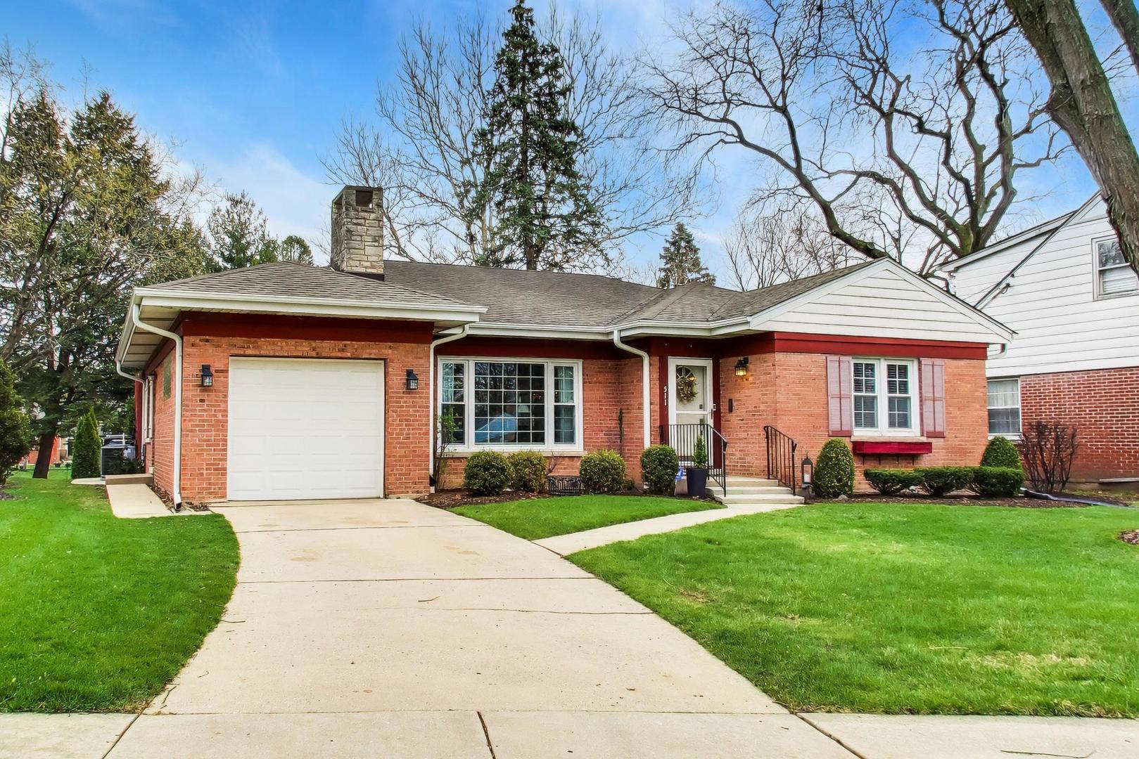 511 South Hi Lusi Avenue Mount Prospect, IL 60056 - Photo 2 of 51 a front view of a house with garden and porch