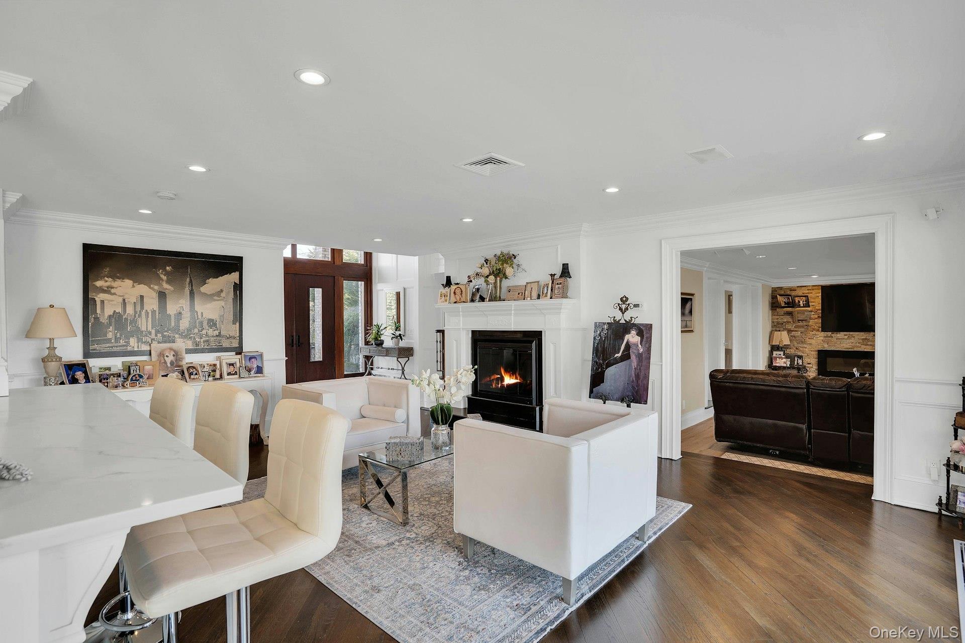 10 Beech Road Islip, NY 11751 - Photo 13 of 49 Hardwood flooring and open living with bar area overlooking kitchen.