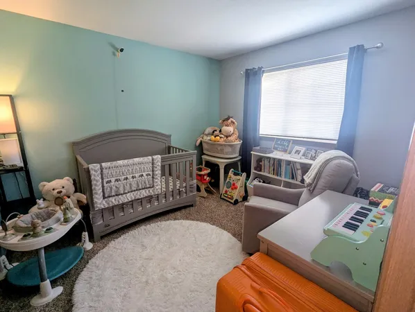 a bedroom with furniture and a wooden floor