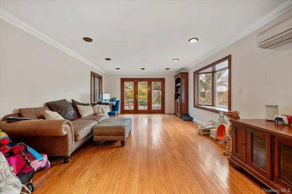 a bedroom with furniture and a window