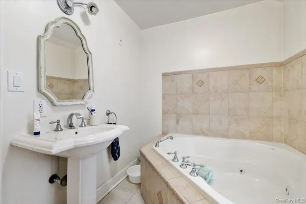a bathroom with a bathtub and a sink