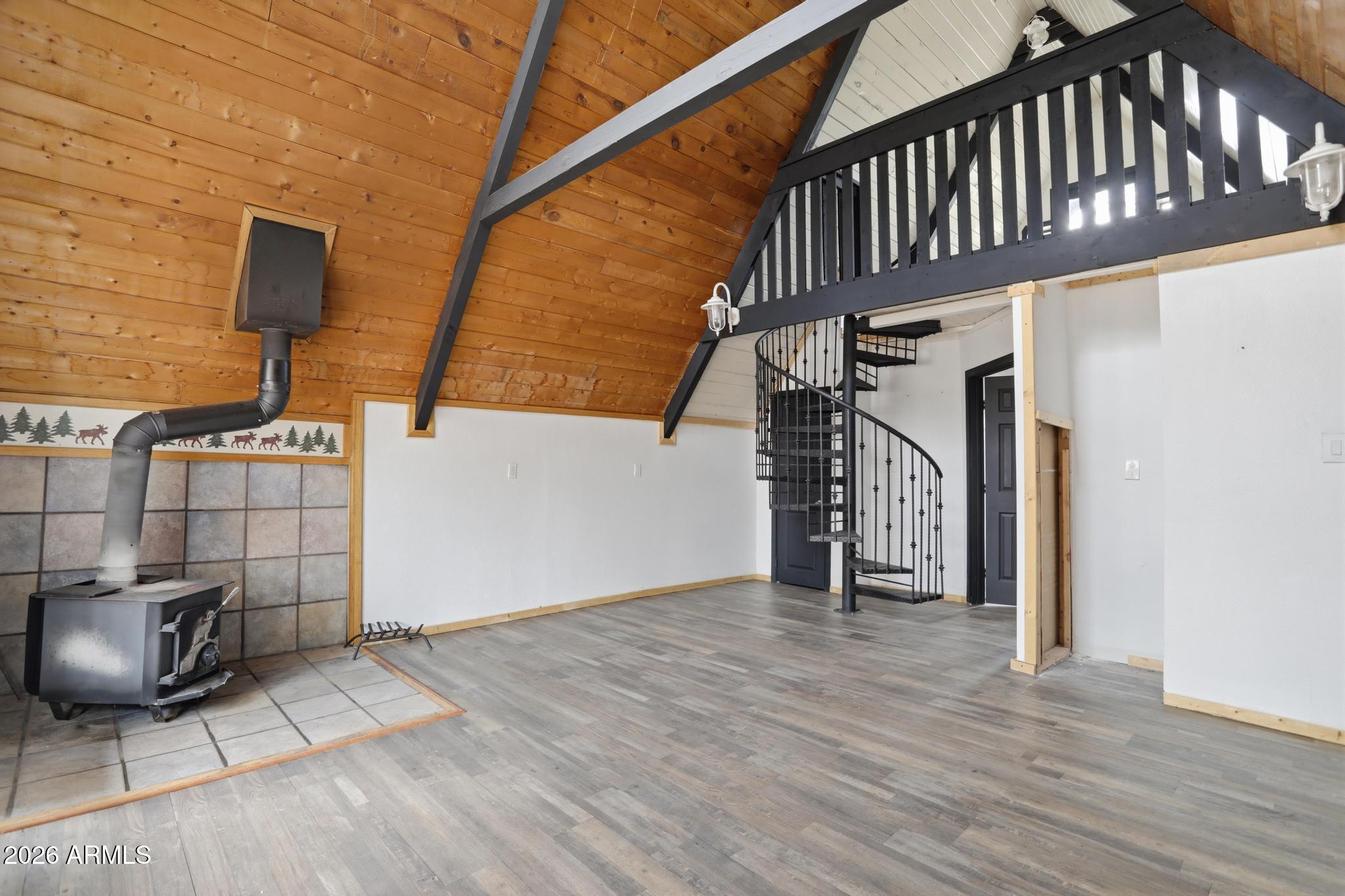 1725 Turkey Mountain Road Happy Jack, AZ 86024 - Photo 5 of 18 a view of staircase with white walls and railing